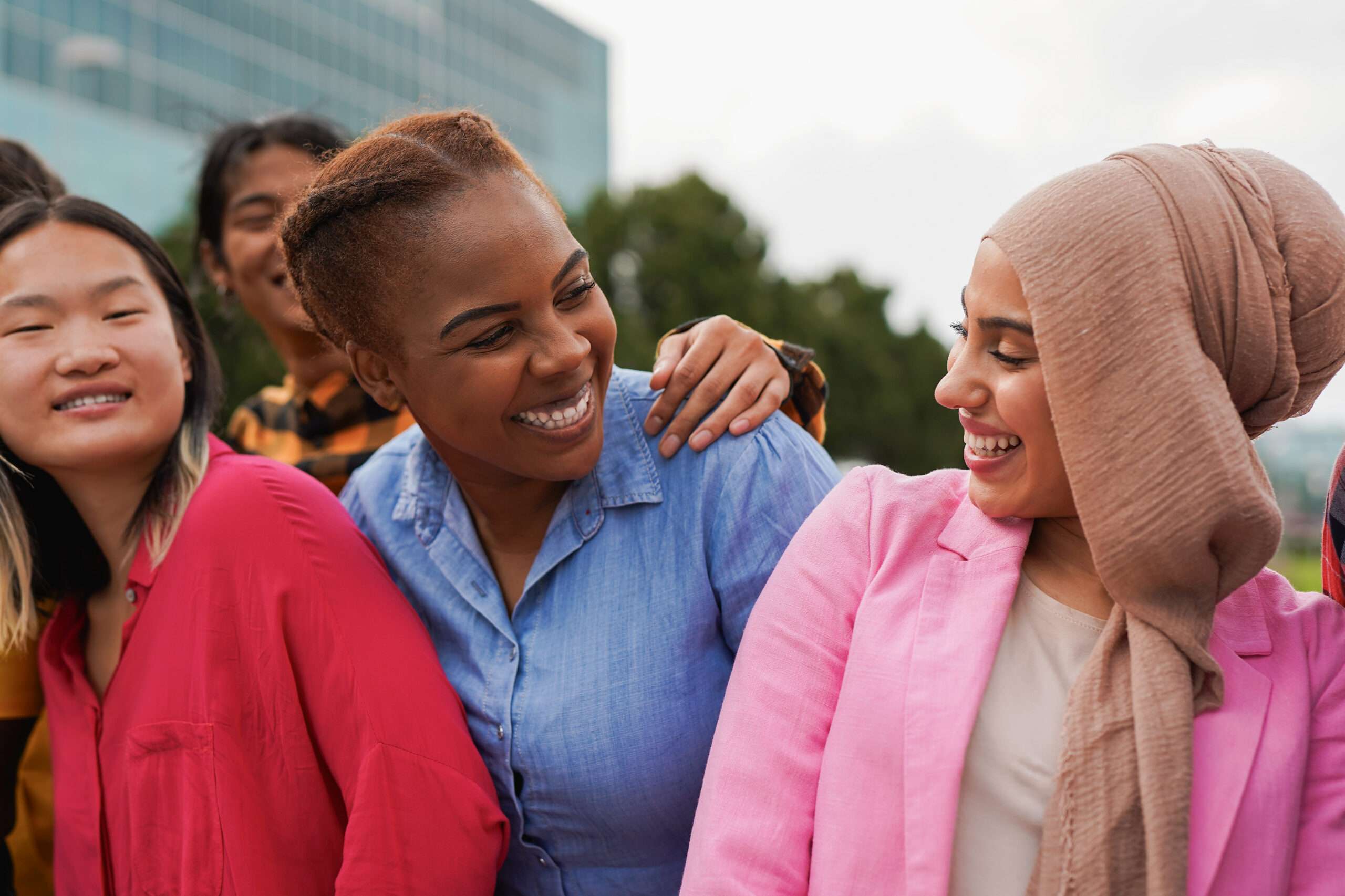 Group of happy young multiracial people having fun together in the city - Diverse friends and party concept - Focus on curvy african woman face